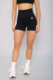Black gym shorts for women – front view, seamless, high-waisted, and perfect for workouts.