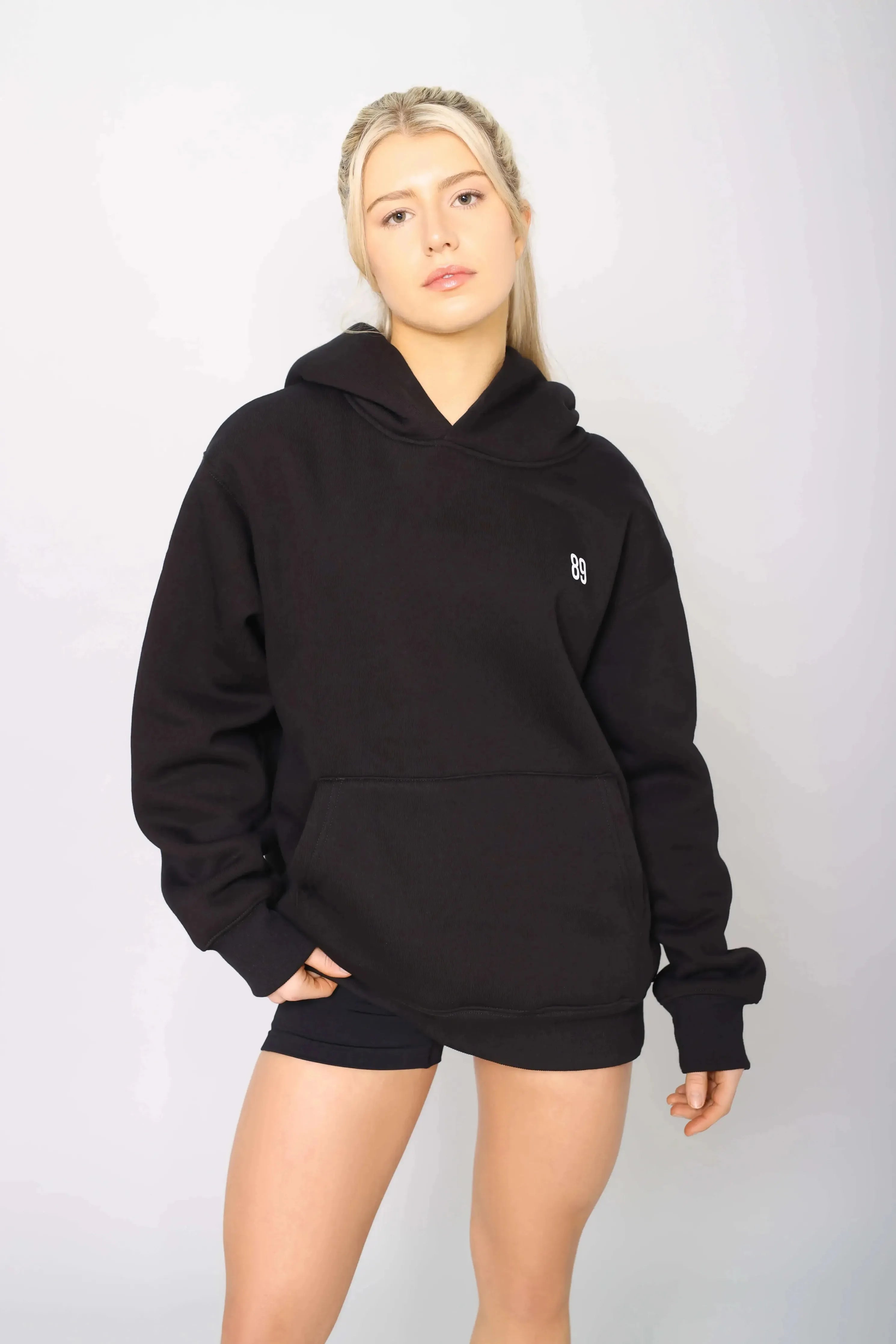Front view of oversized black gym hoodie with a heavy lined interior for warmth