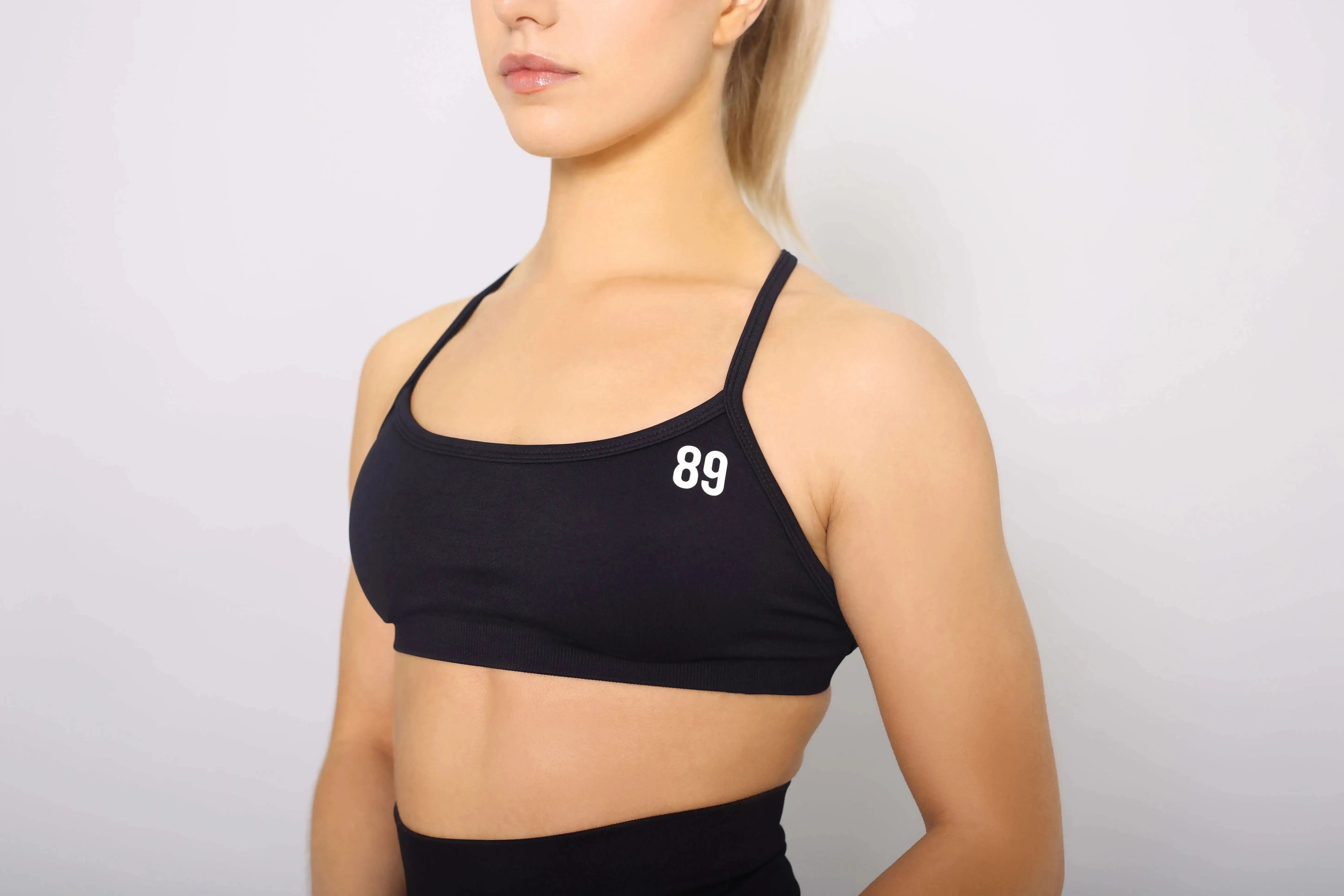 Black Sports bra for yoga, side view, medium support