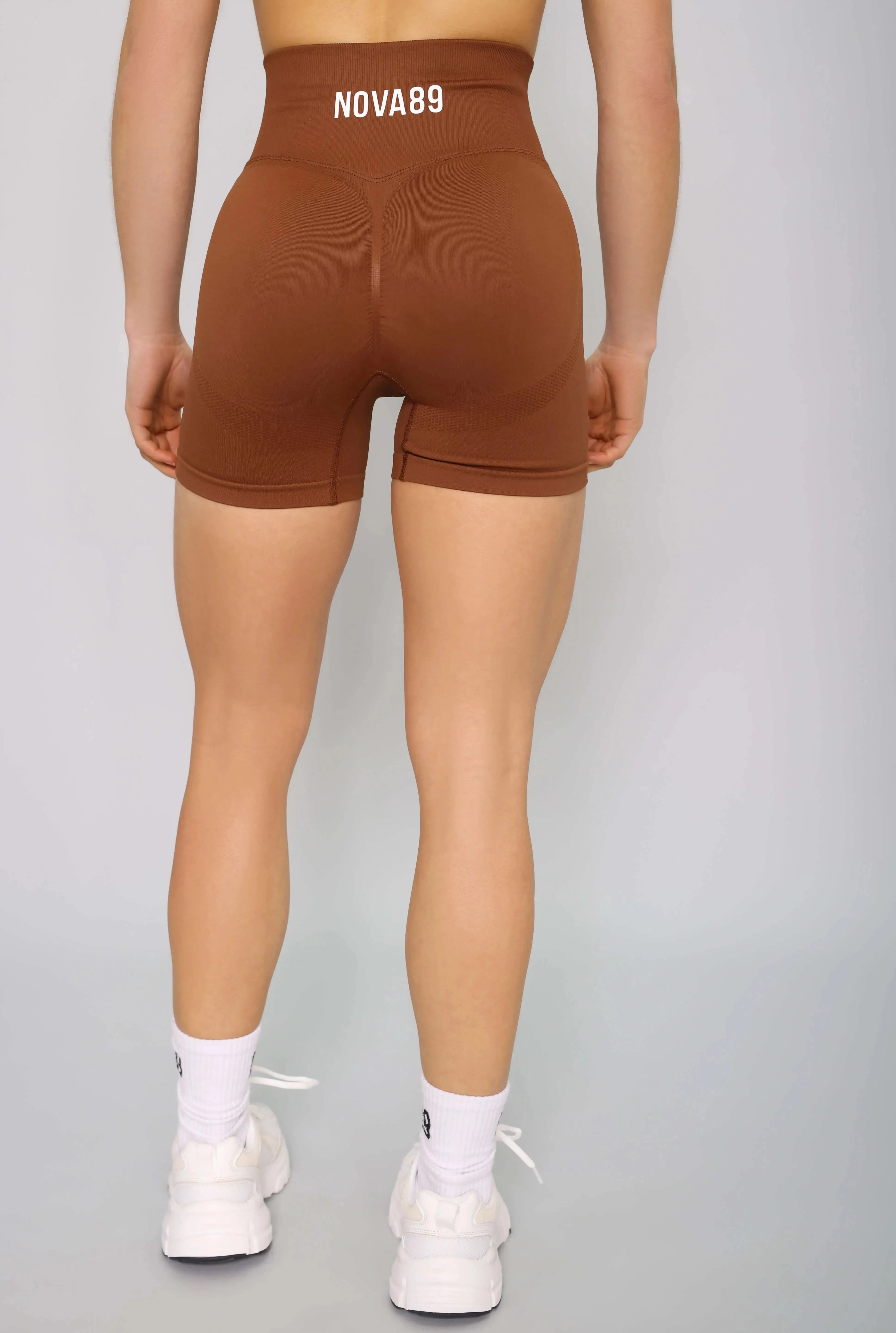 Brown seamless gym shorts – back view, soft, flexible, and ideal for workouts.