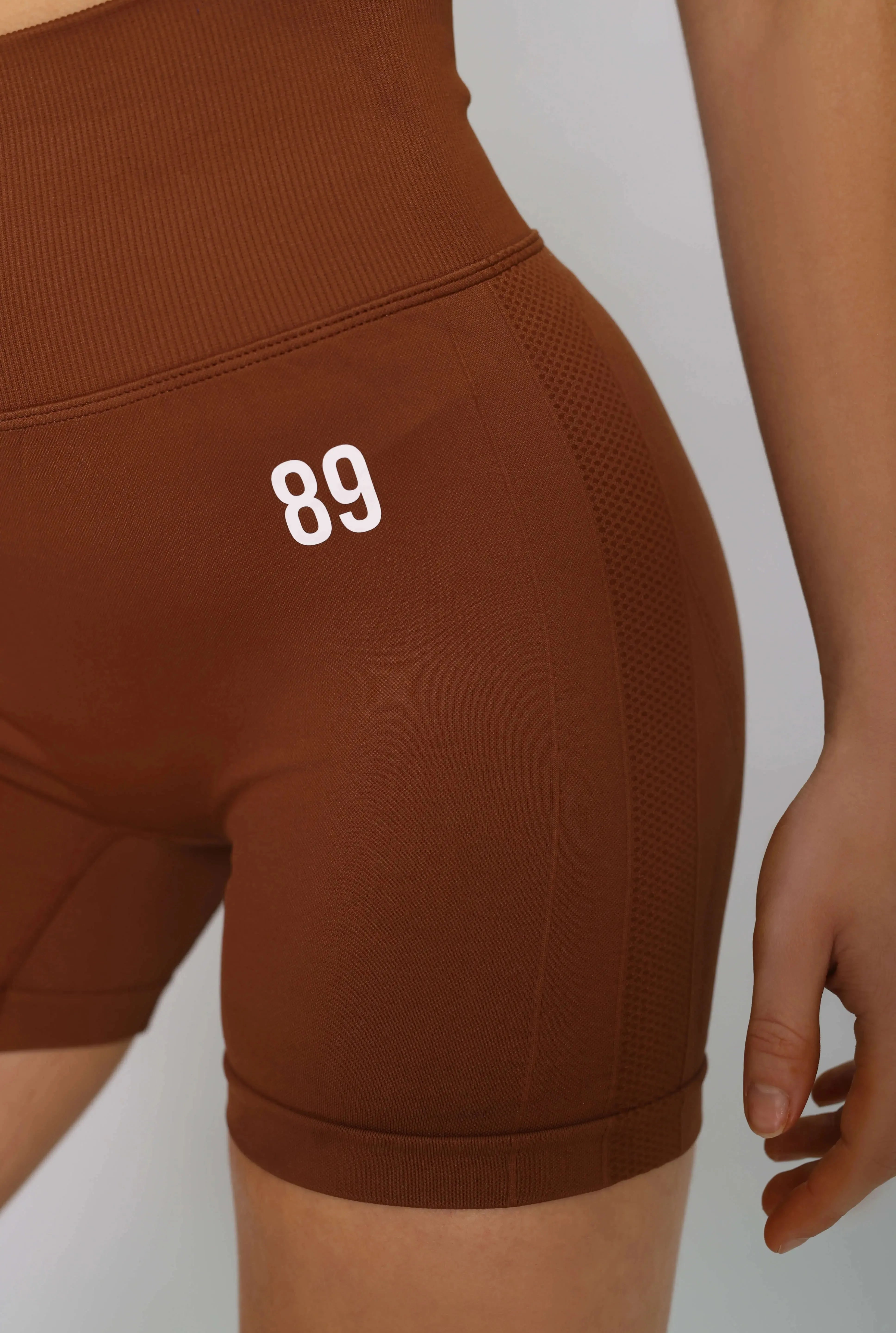 Brown bum scrunch gym shorts – side view, with high-waisted fit.