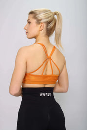 Burnt orange sports bra with padding, back view