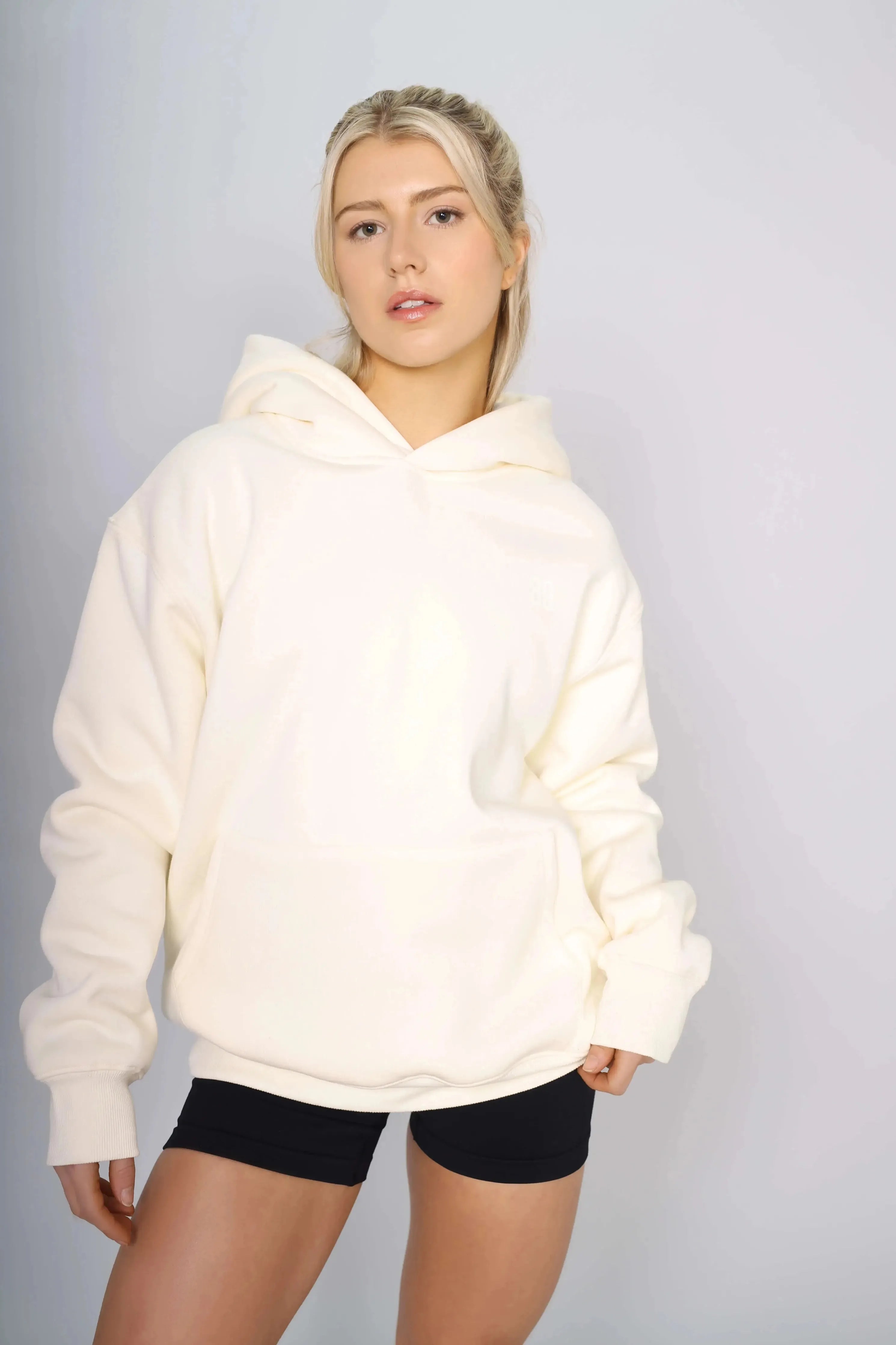 Front view of a Cream Beige oversized gym hoodie with a warm lined design