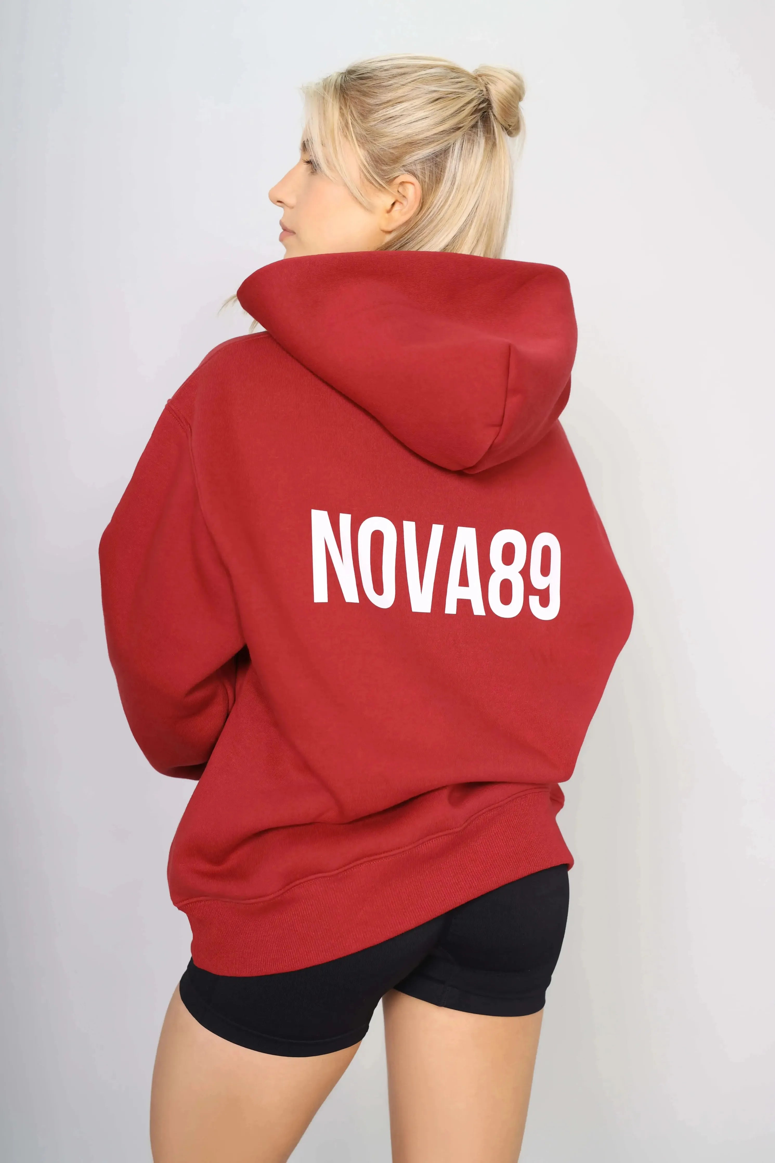 Back view of an oversized pullover womens gym hoodie in red