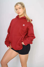 Side view of a heavy red gym hoodie for training