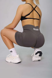 Dark grey bum scrunch gym shorts – flattering design for workouts, side view.