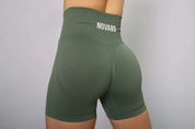Green bum scrunch gym shorts – scrunch design enhances fit and curves, side view.