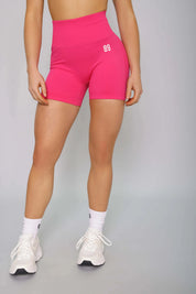 Hot pink scrunch gym shorts – front view, squat-proof and designed for confidence in the gym.