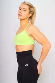 Sports bra adjustable with lime colour, side view