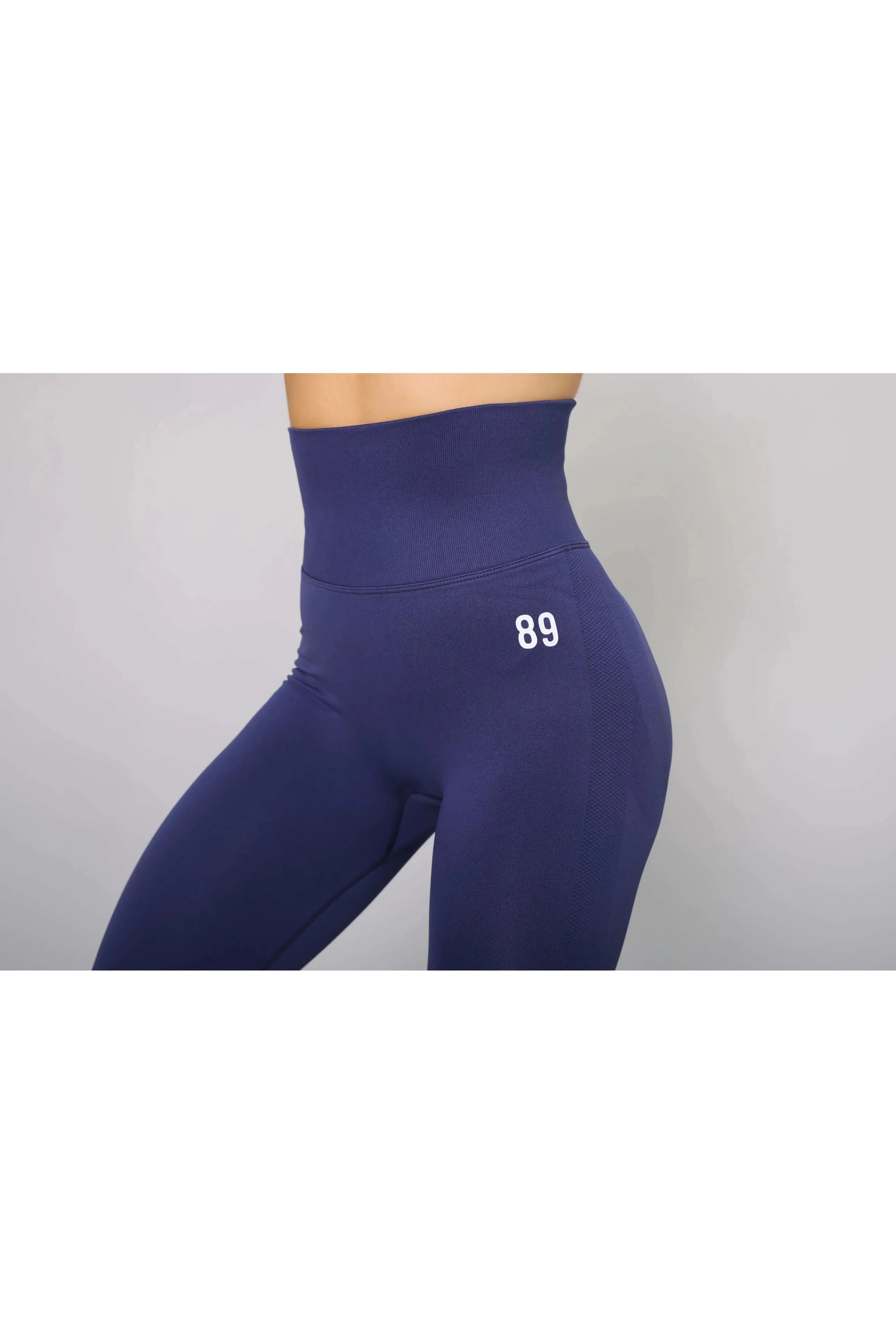 Navy blue tummy control leggings – side view, high-waisted and perfect for gym workouts