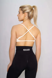Off white sports bra with medium support, back view