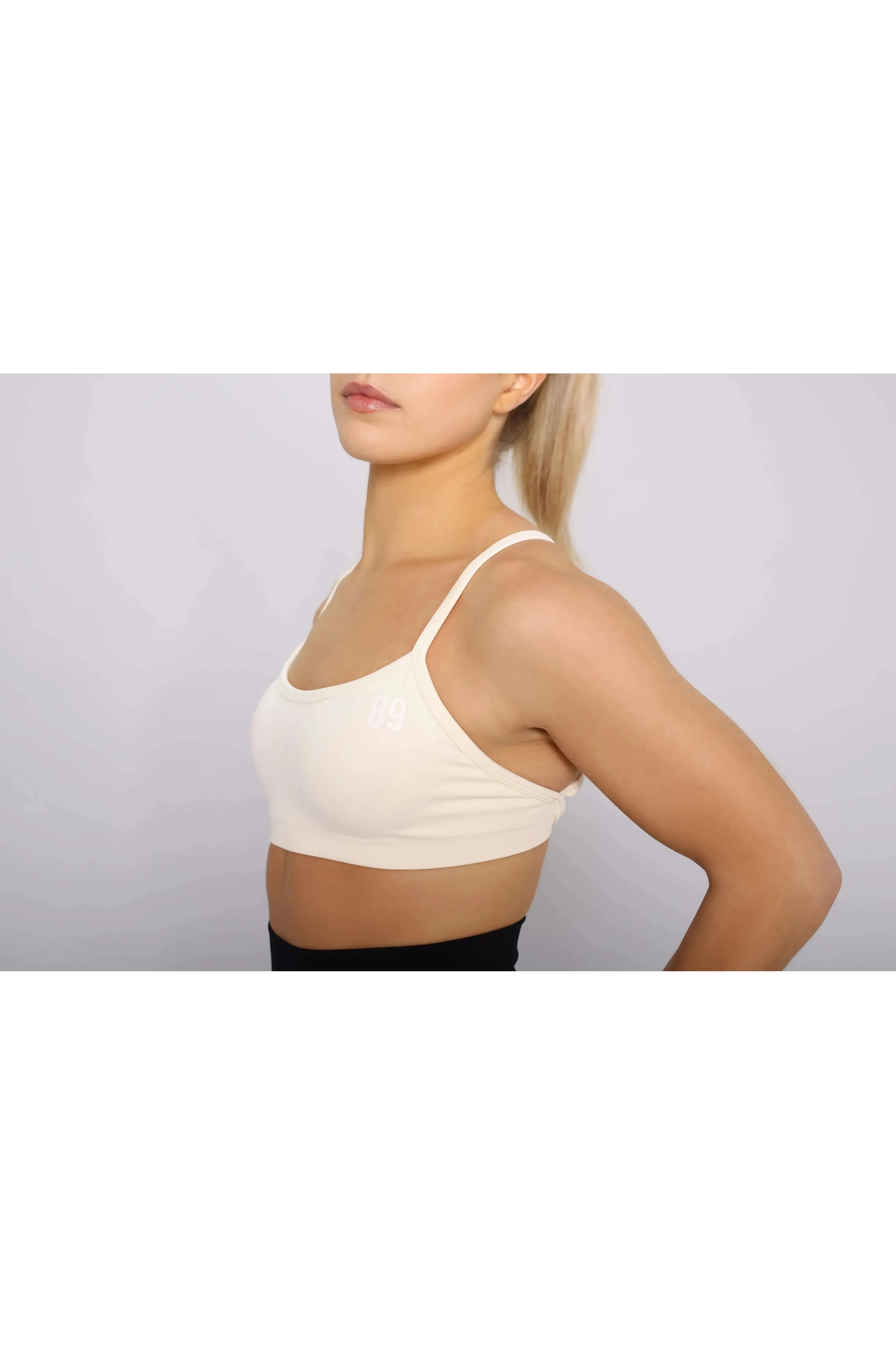 Off-White Sports bra with removable pads, side view, medium support