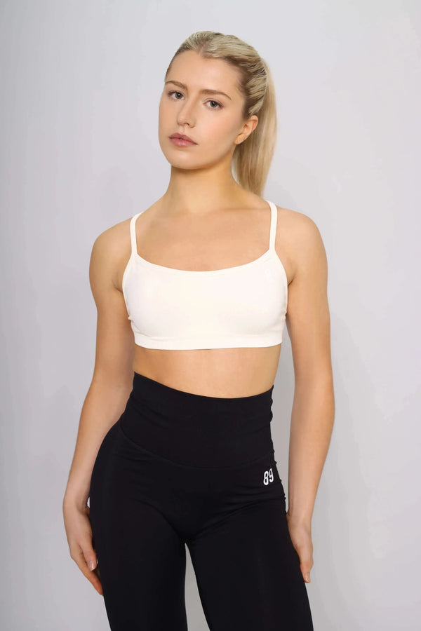 Off white sports bra designed for running, front view
