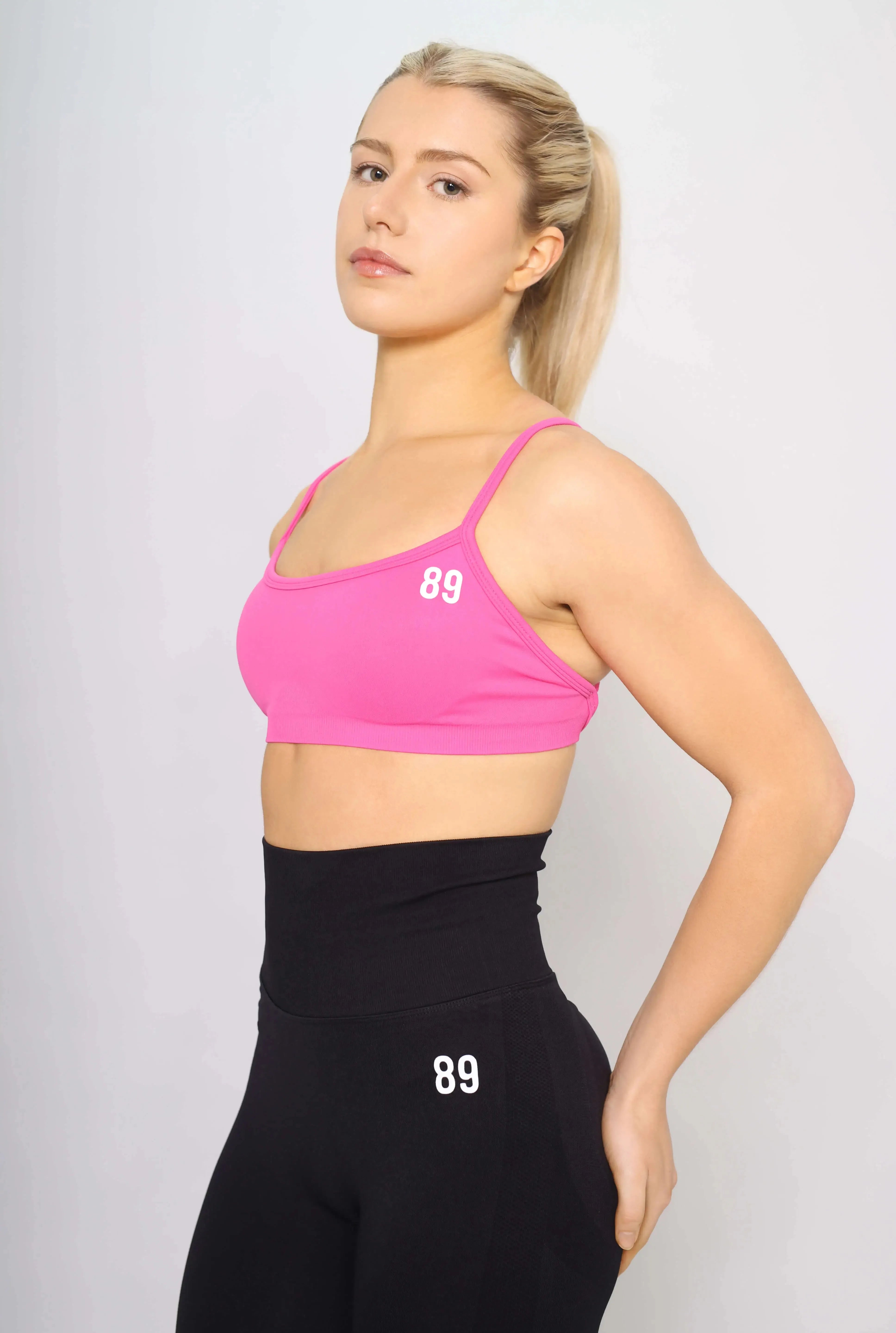 Pink Sports bra for CrossFit, side view, medium support