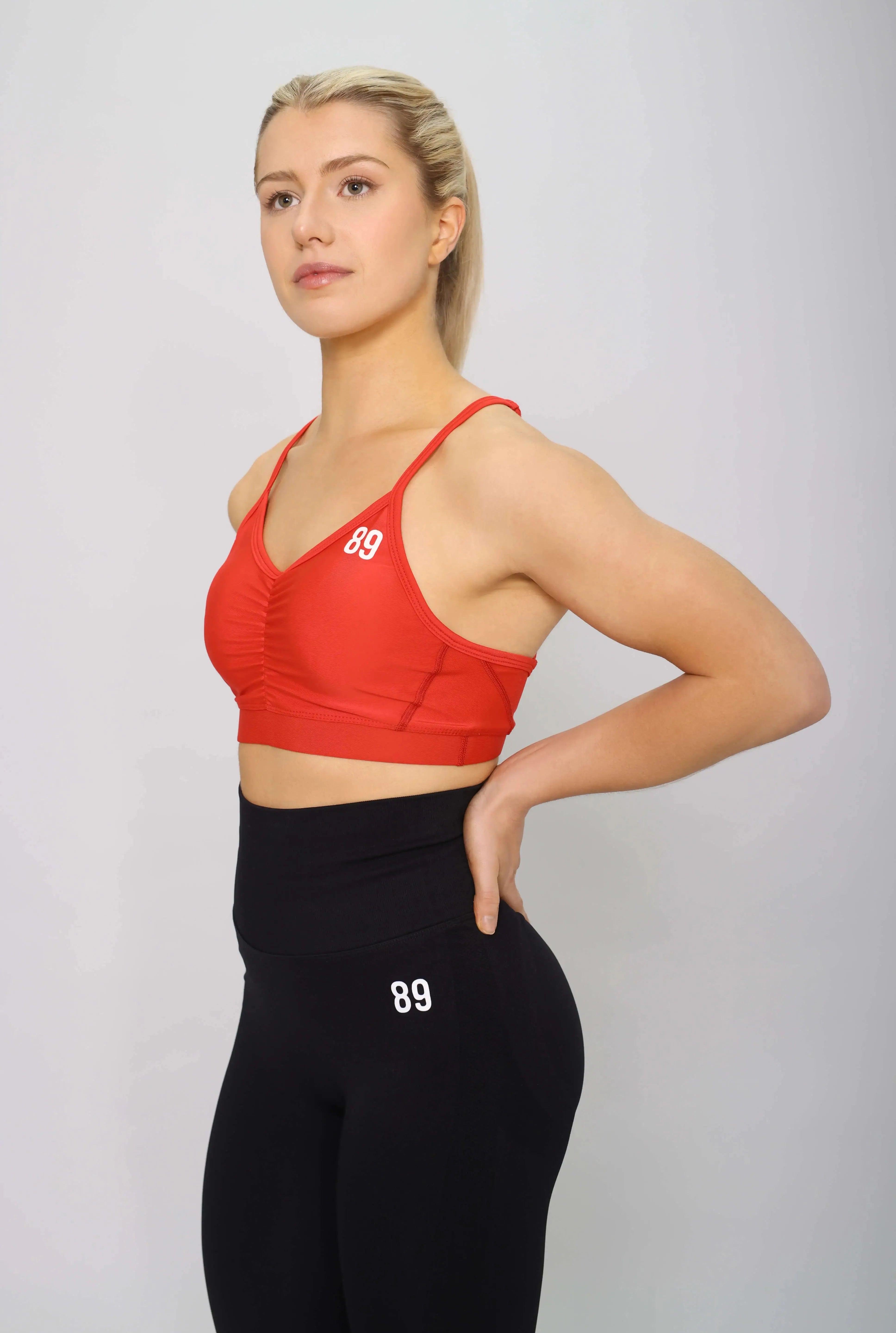 Red sports bra for yoga, side view