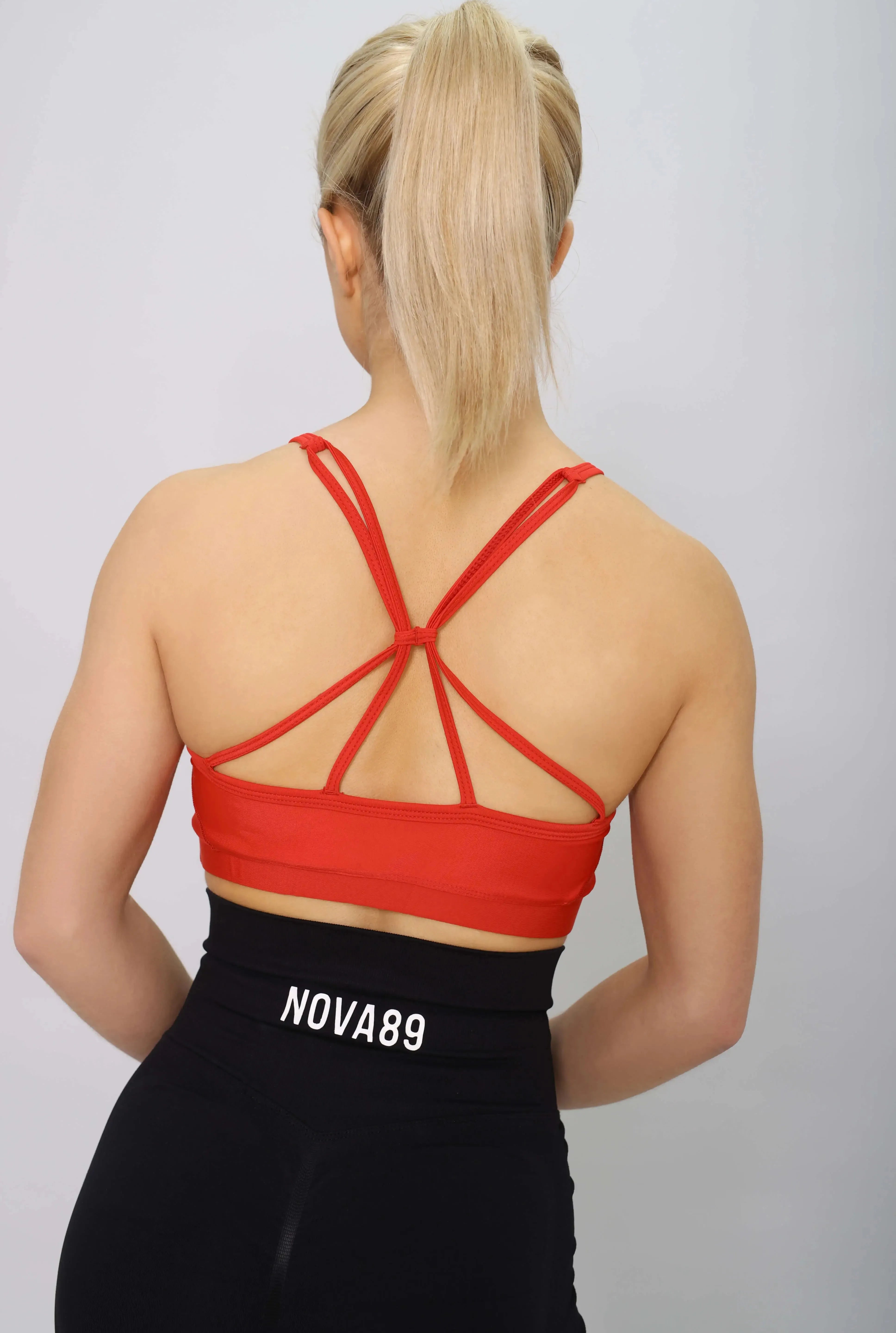 Red sports bra with light support, back view
