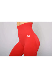 Scarlet red activewear leggings – side view, high-waisted and moisture-wicking for workouts