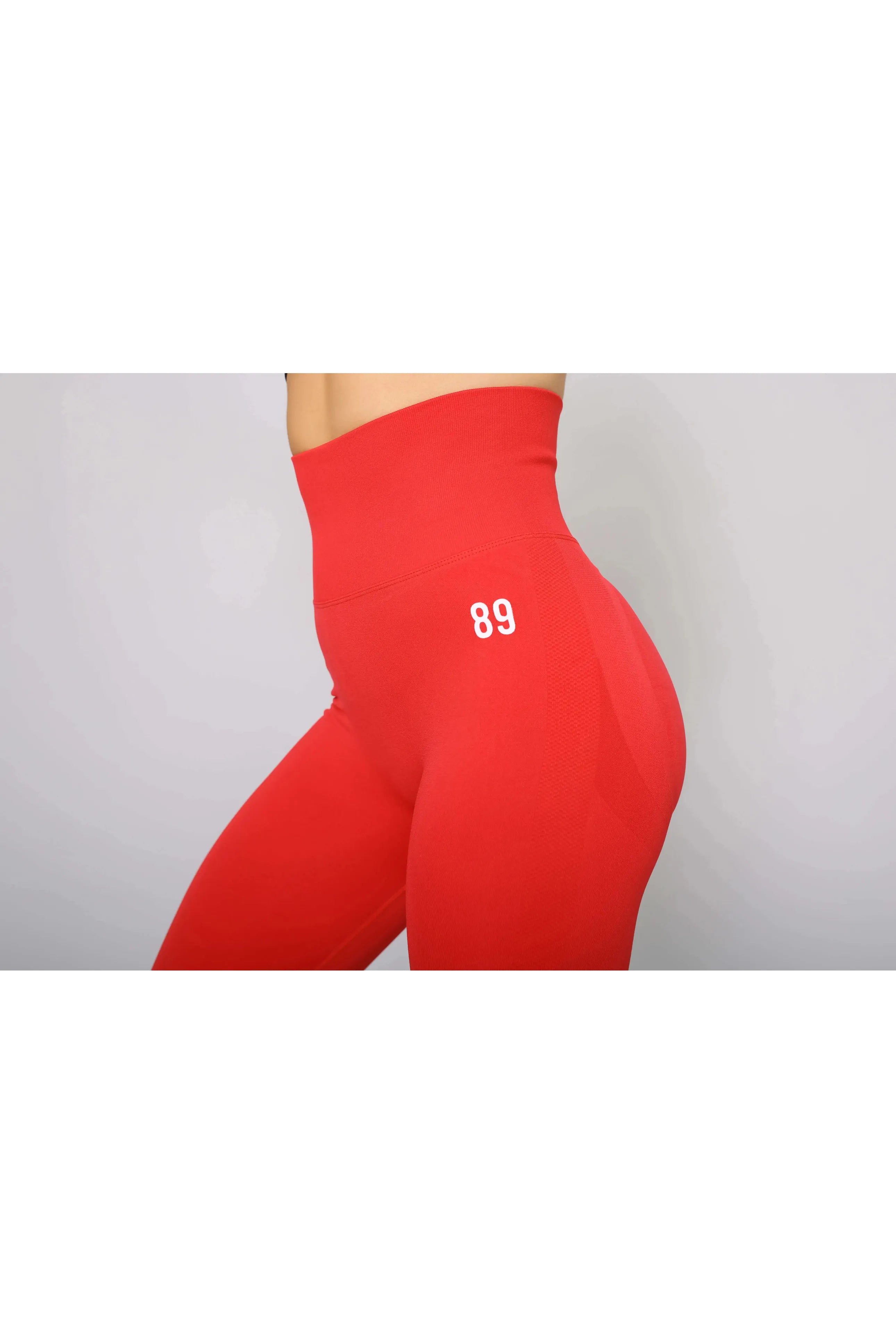 Scarlet red activewear leggings – side view, high-waisted and moisture-wicking for workouts