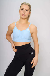 Sky blue sports bra designed for running, front view