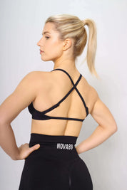 Sports bra in black, medium support, back view