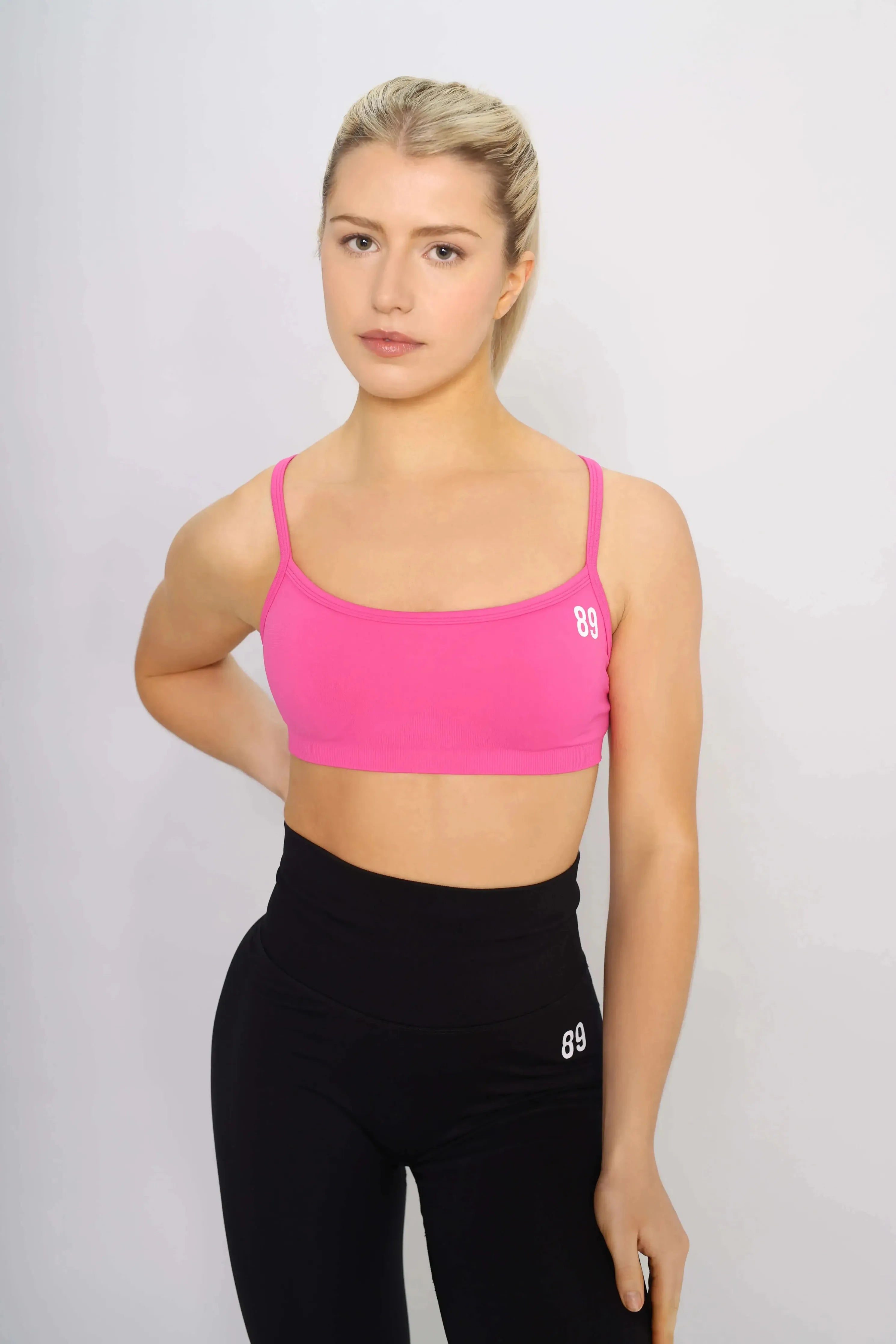 Sports bras pink, front view, medium support