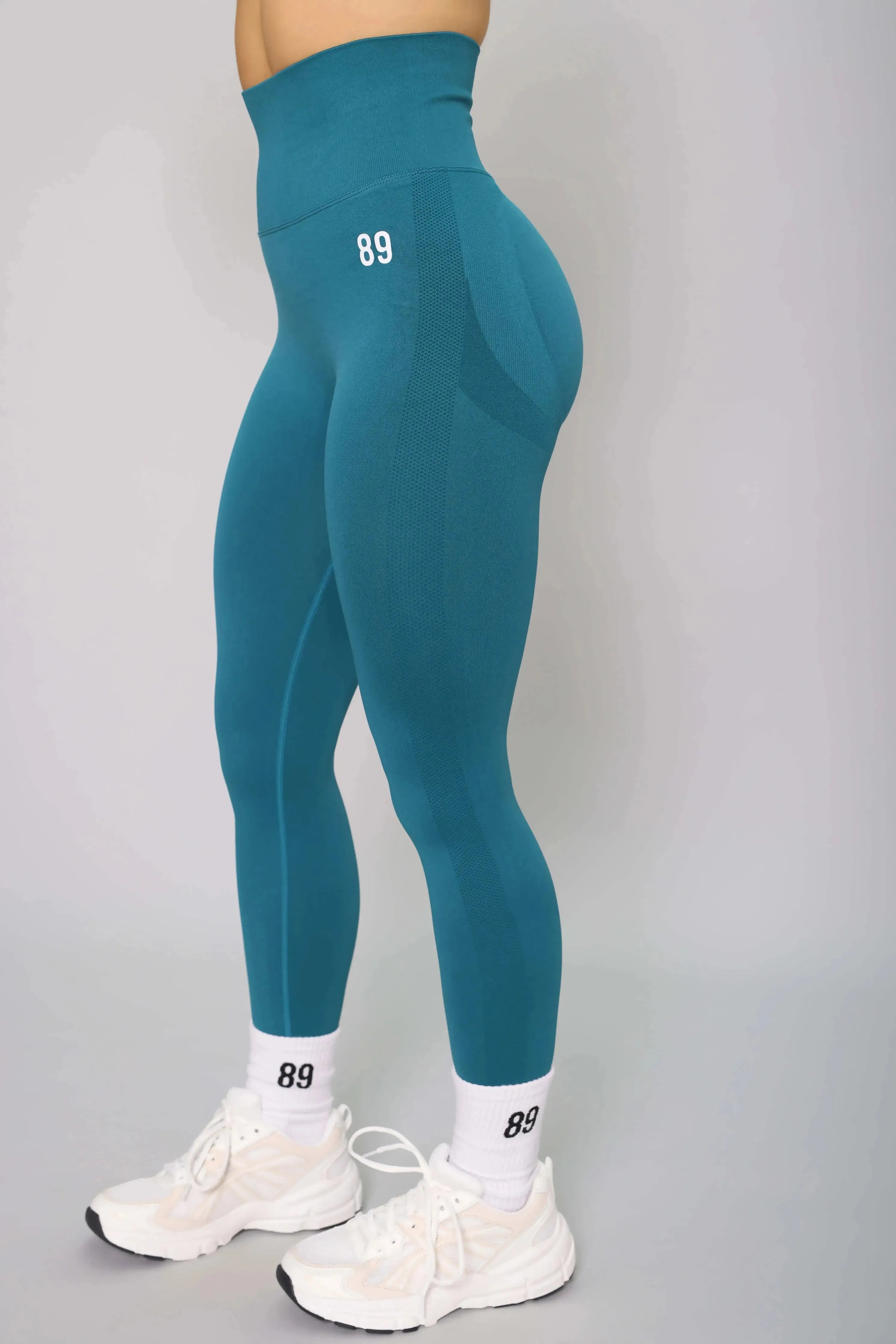 Teal scrunch bum yoga leggings – side view, designed for flexibility and comfort