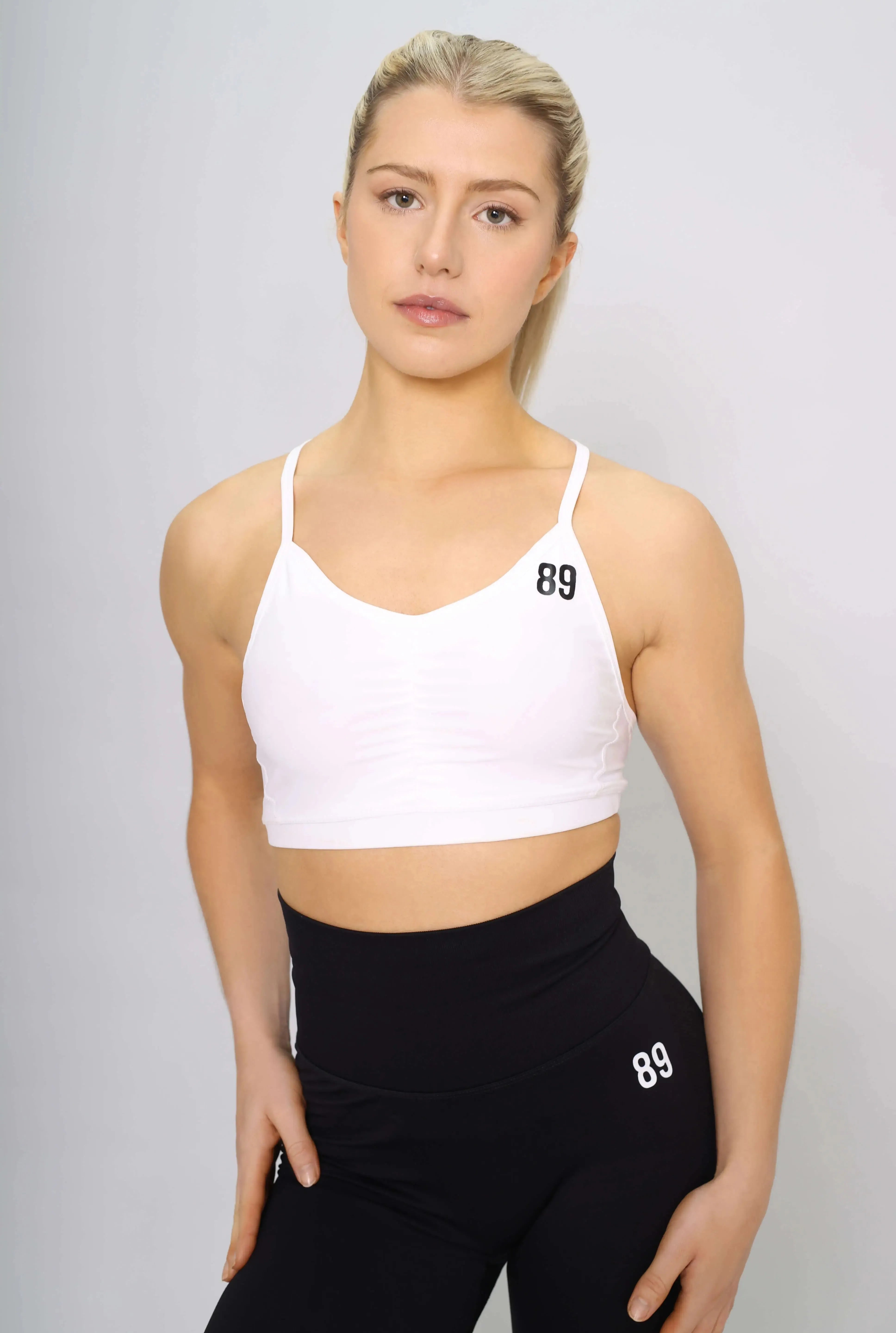 White sports bra with strappy-back design, front view